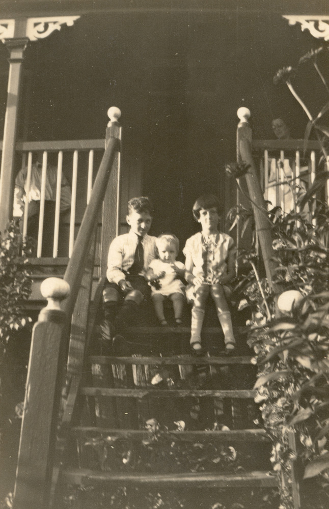 Keith and Julia O'Connell with  young child on stairs, Bergin's Hill, Bundamba, Ipswich