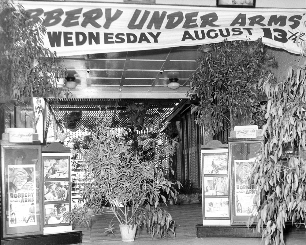 Film posters and banner at the front of the Wintergarden Theatre, Ipswich, for the film 'Robbery Under Arms', 1957