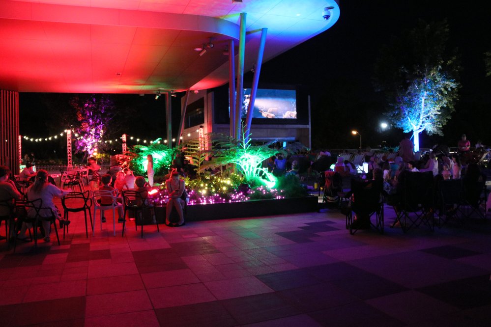 Watching the Christmas movie on the big screen as part of Christmas in Ipswich: St Nicholas Precinct, Nicholas Street Precinct &amp; Tulmur Place, Ipswich, 2021