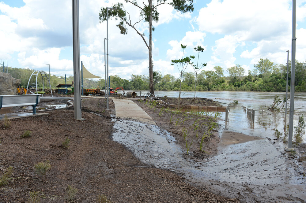 Cleaning up after floods at Colleges Crossing, January 2013