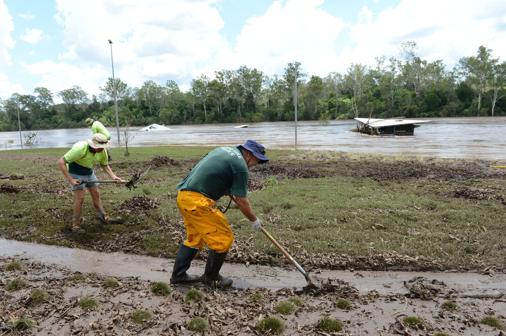 Cleaning up after flooding at Colleges Crossing, January 2013