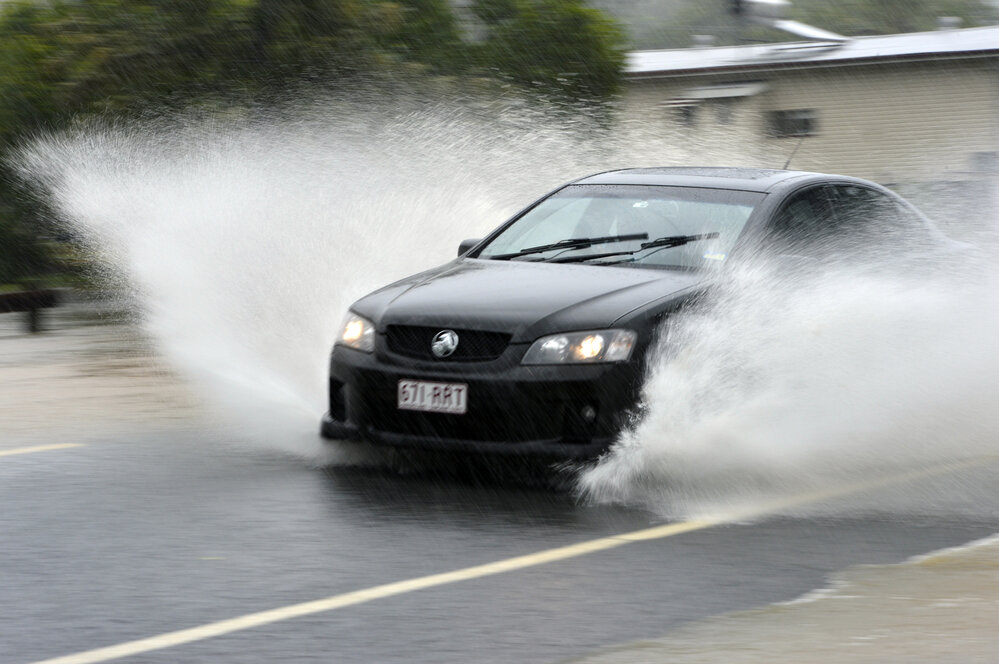 Car driving through flood water, Smiths Road, Goodna, Ipswich, January 2013