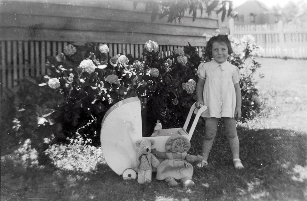 Child with home made doll and pram, Ipswich, 1940s