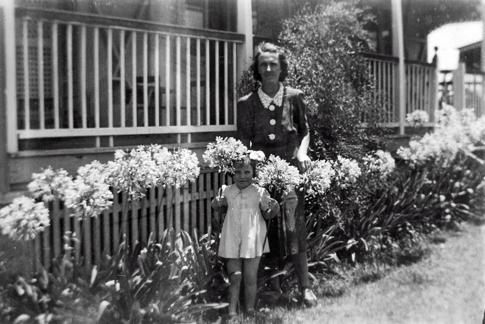 Woman and child in front garden of home in Shelley Street, Brassall, Ipswich, 1940s