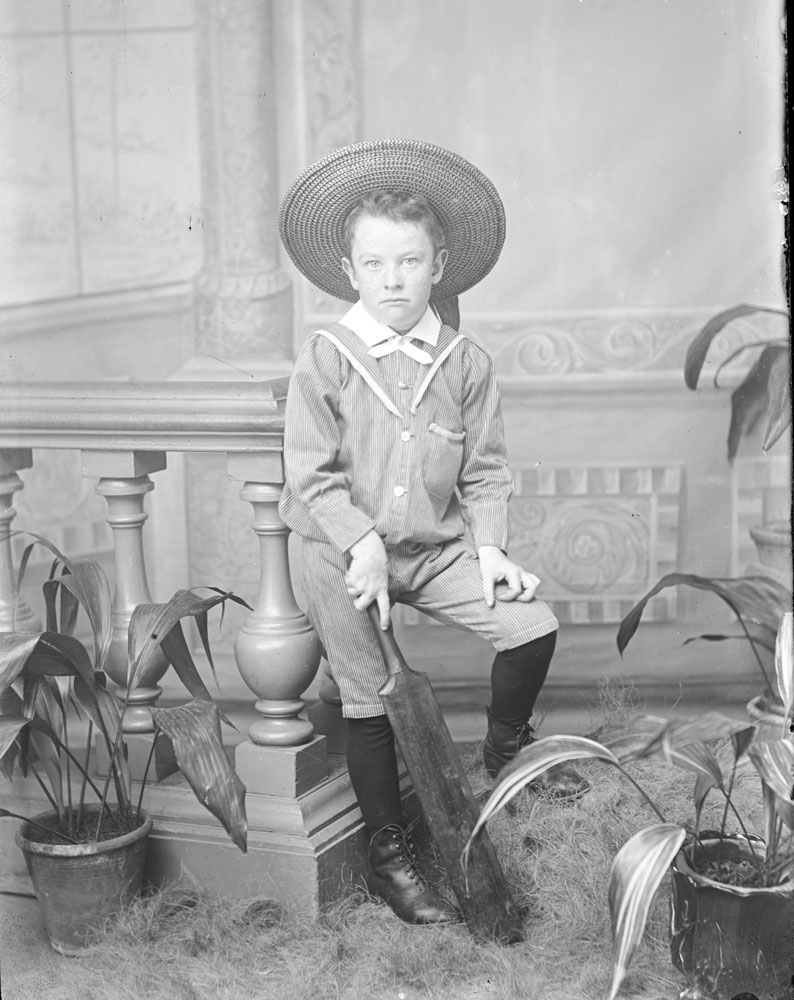 Studio portrait of an unidentified boy with cricket bat, I.X.L. Studios, Nicholas Street, Ipswich, 1900s