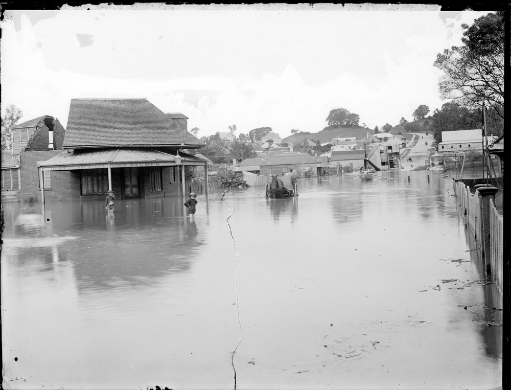 Brisbane Street, looking east towards Limestone Hill, during flood, Ipswich, 1893