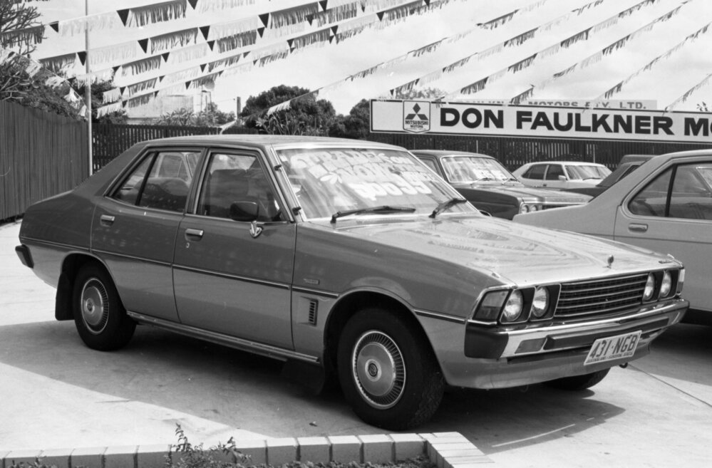 Sigma car at Don Faulkner Motors car yard, Ipswich, September 1981