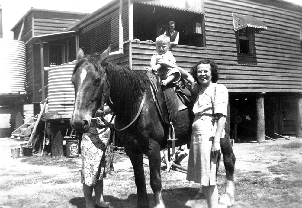 Family on farm between Rosewood and Ebenezer, Ipswich, 1940s
