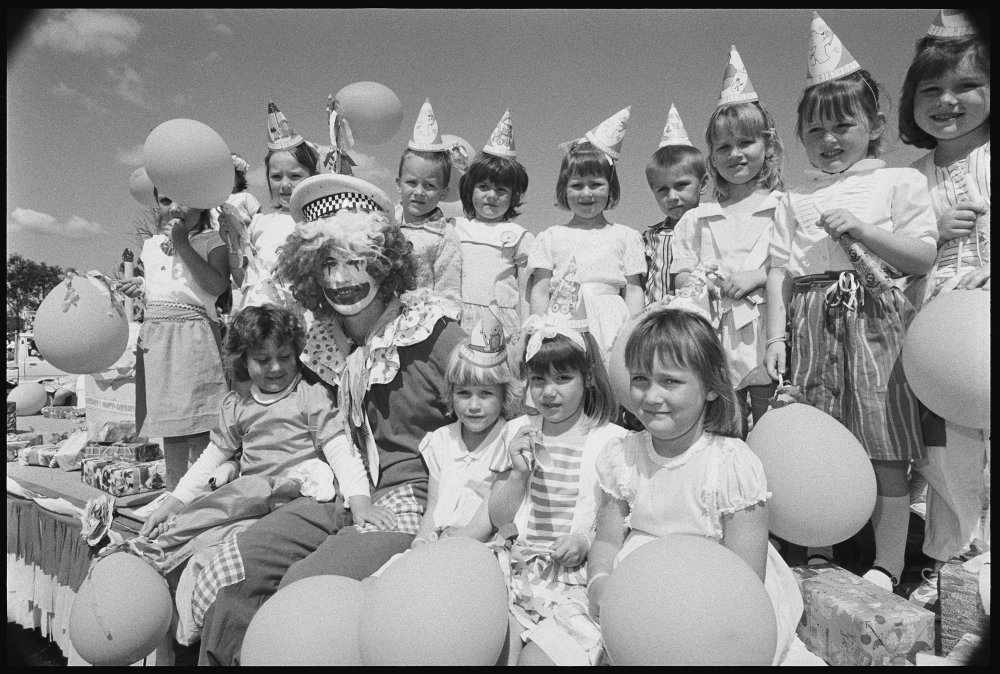Unidentified children with a clown on a parade float at the Laidley Spring Festival, Laidley, Lockyer Valley, September 1987