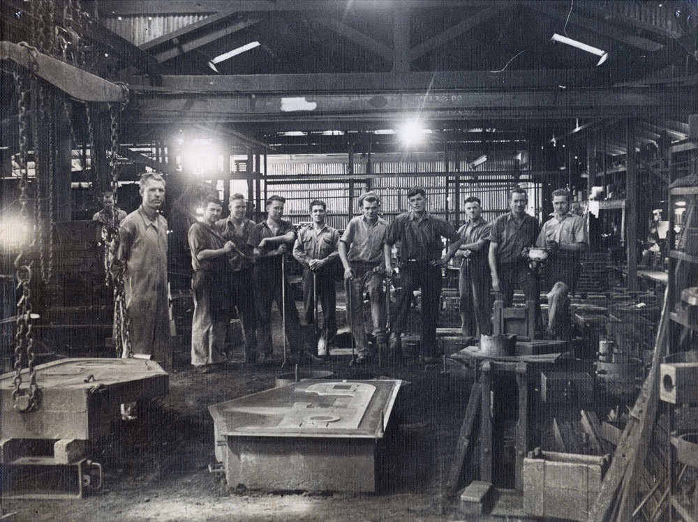 Staff at Scotts Foundry with bandsaw frame for a butcher shop, Ipswich, 1950s