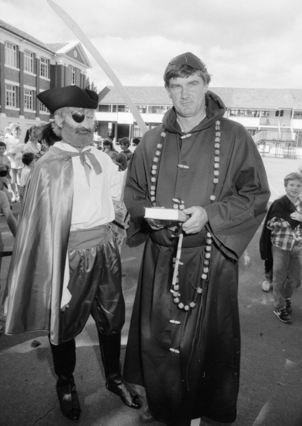 Two unidentified men in costume for Ipswich North State School Book Week parade, North Ipswich, August 1987