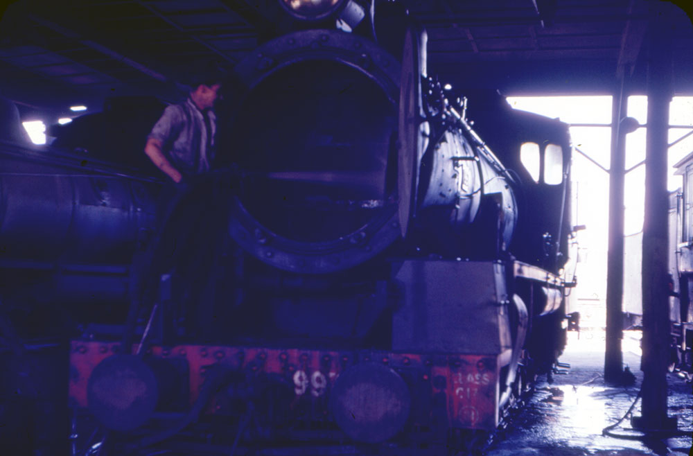 Steam cleaning locomotive at the Ipswich Railway Workshops Roundhouse, North Ipswich, 1969