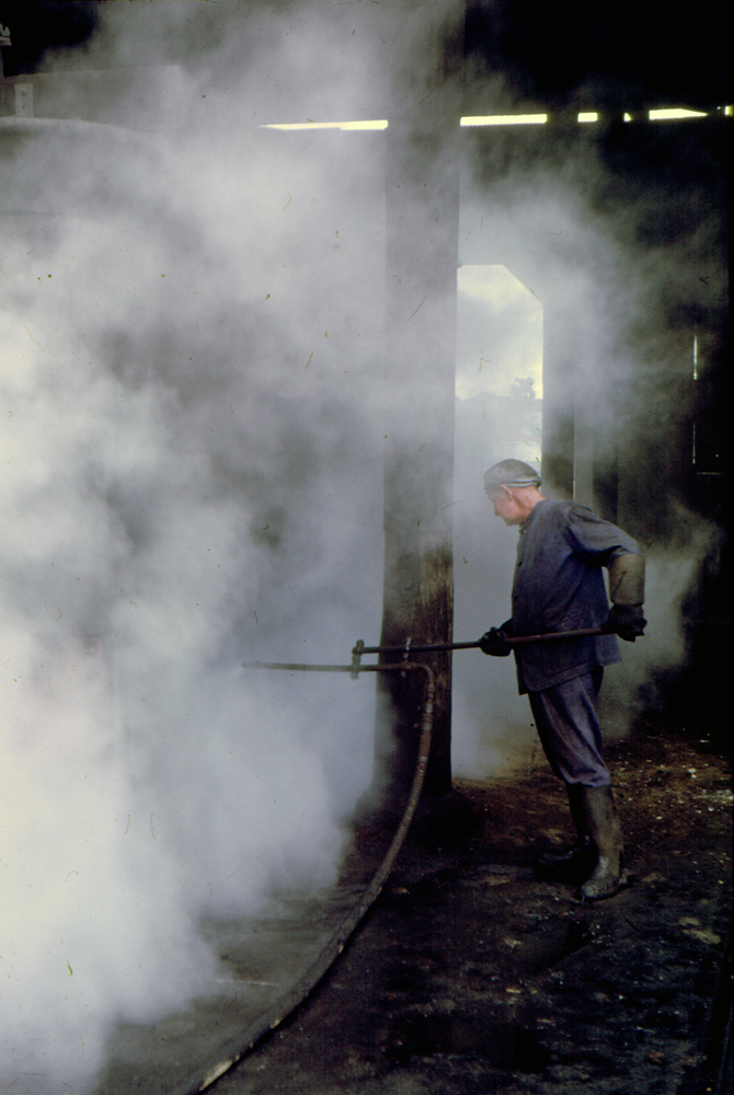 Steam cleaning locomotive at the Ipswich Railway Workshops Roundhouse, North Ipswich, 1969