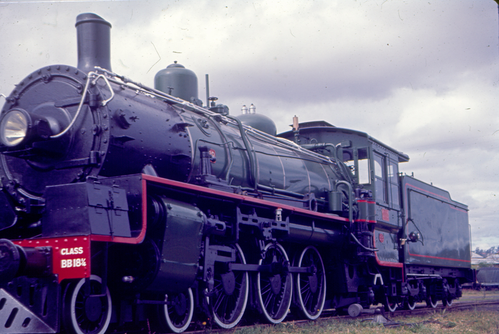 Restored steam locomotive at North Ipswich Railway Workshops, prior to relocation to Queensland Railways Locomotive Museum at Redbank, c.1970
