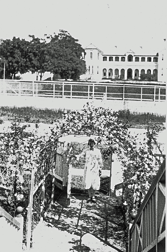 Muriel Johnson in the front of  'Cremona' at 83 Chermside Road, East Ipswich, c.1920