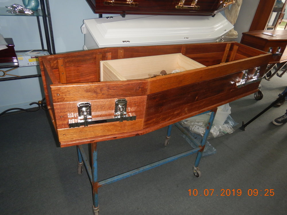 Placing Fleming family remains in an ossuary box prior to reinternment, Ipswich, 10th July 2019