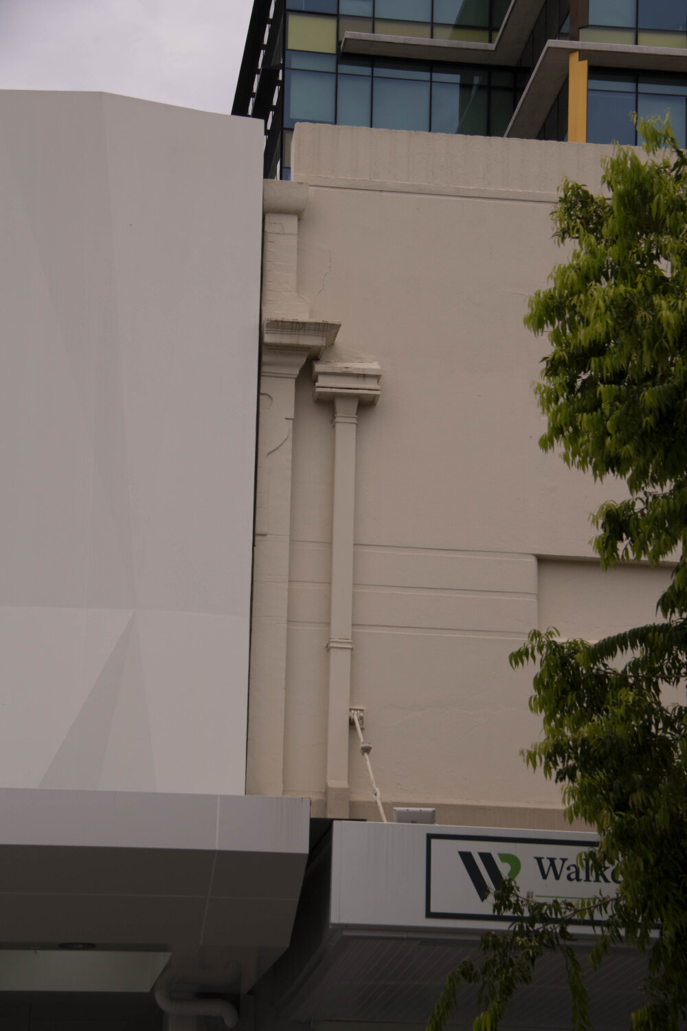 Detail of downpipe and edge of 28 Nicholas Street, Ipswich, March 2023