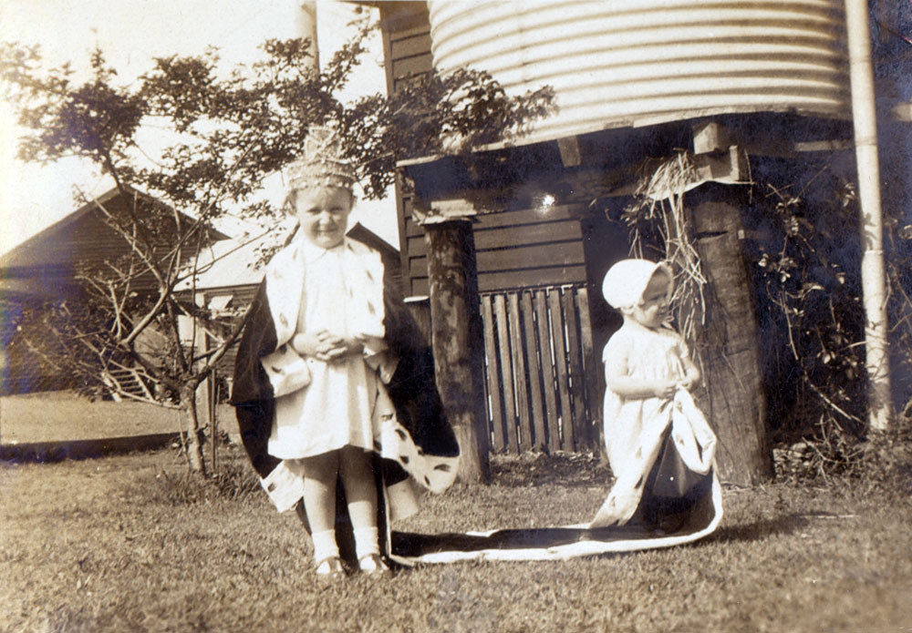 Shirley and Claire Evans playing 'dress ups'  at Goodna, Ipswich, 1935