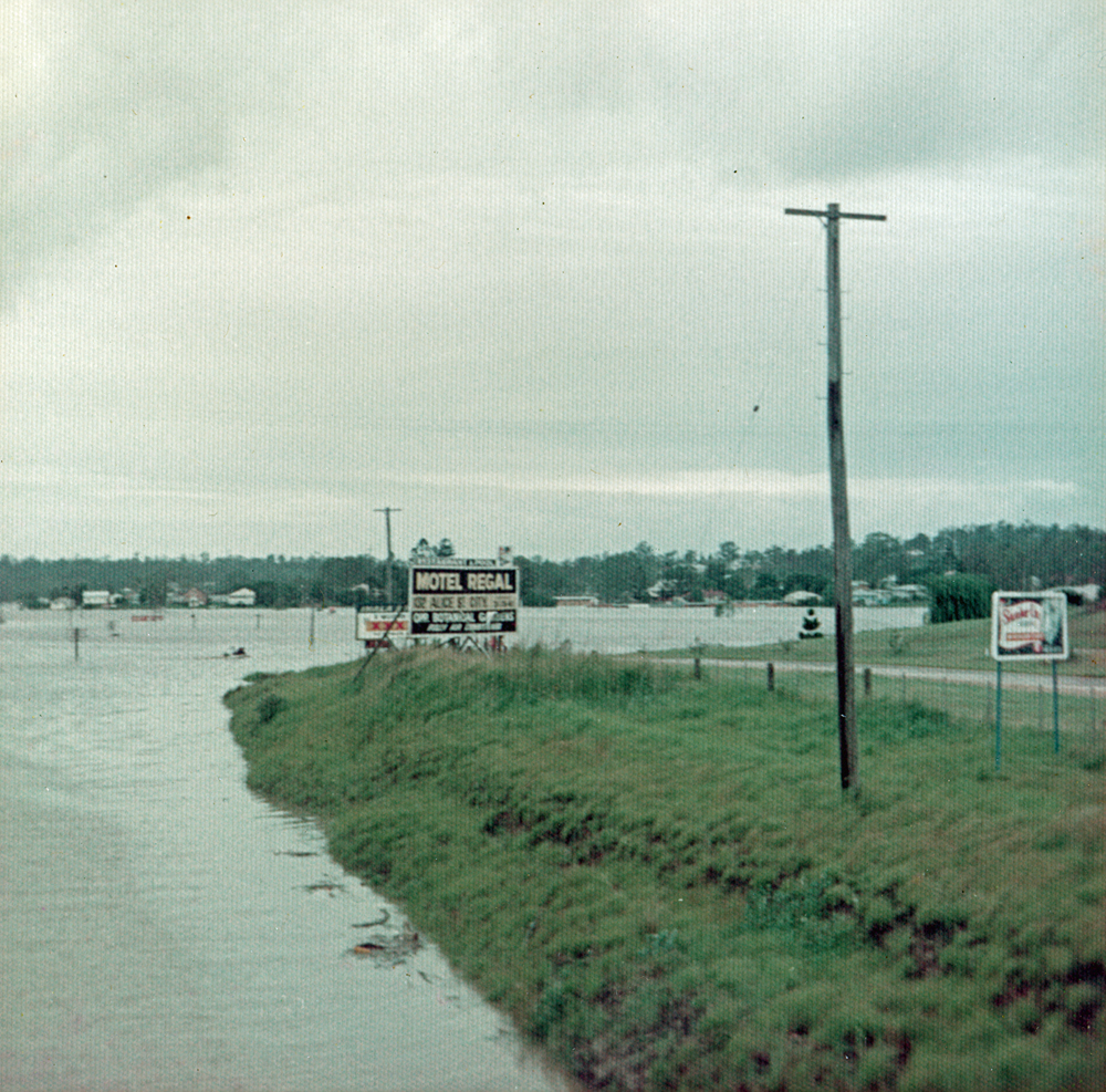 View from railway overbridge of floods, Goodna, Ipswich, 1974