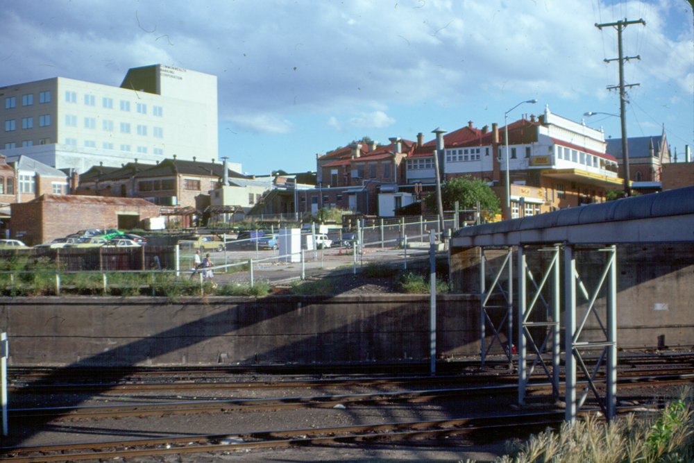 View of buildings on Brisbane Street, from railway lines, Ipswich, 1985
