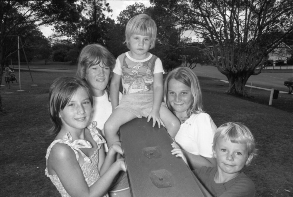Children playing on a see-saw in a park, Ipswich, Queensland, January 1978