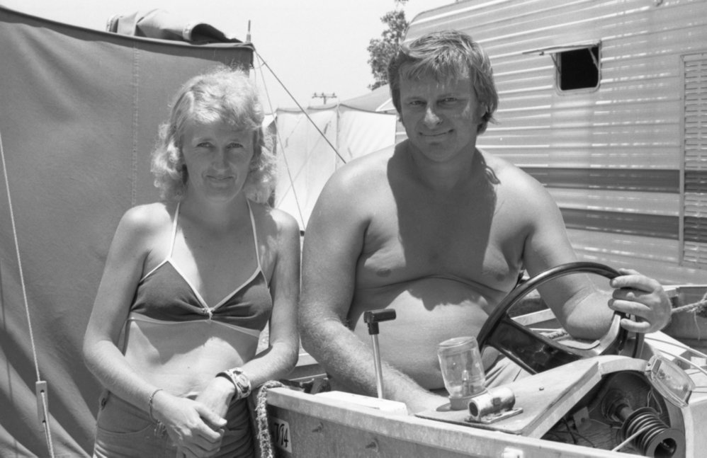 Unidentified couple, thought to be from Ipswich, with boat on holiday, Queensland, January 1978