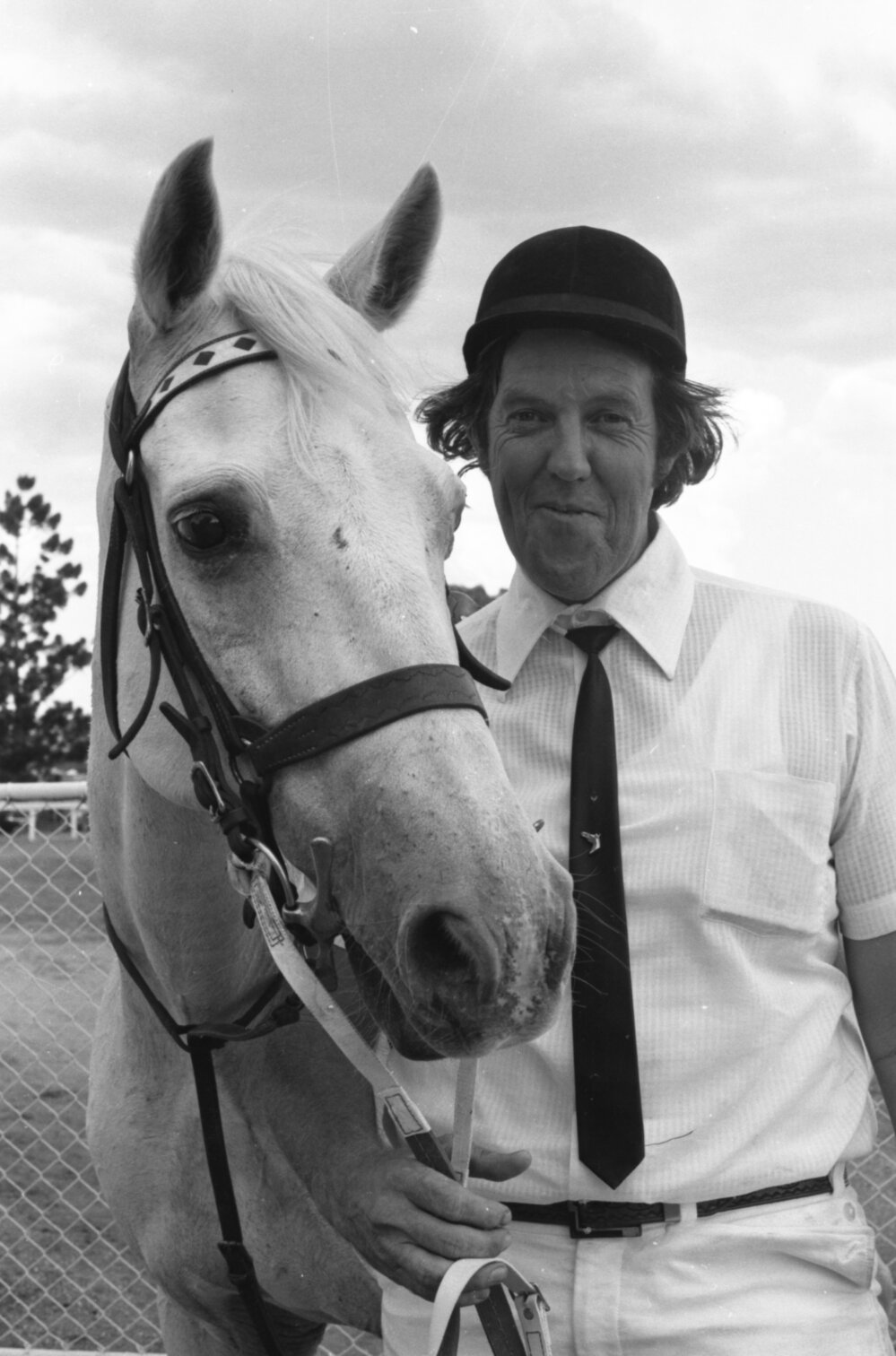 Ipswich Turf Club track official Ron Corvi with horse at Ipswich Turf Club, Bundamba, Ipswich, January 1978