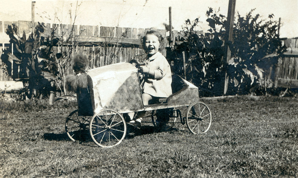Young girl in toy car made by her father, Ipswich, c.1927
