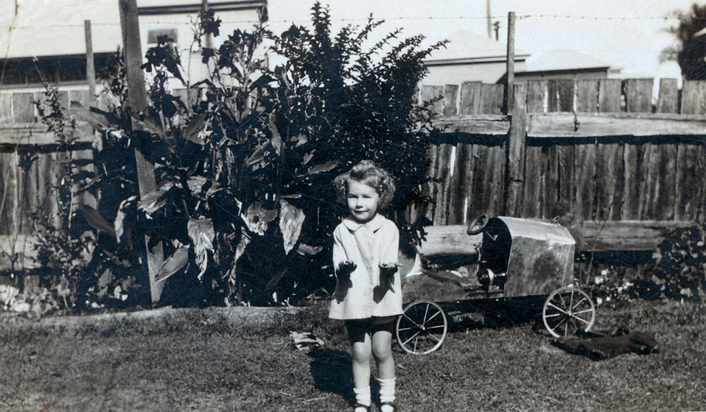 Young girl with toy car made by her father, Ipswich, c.1927