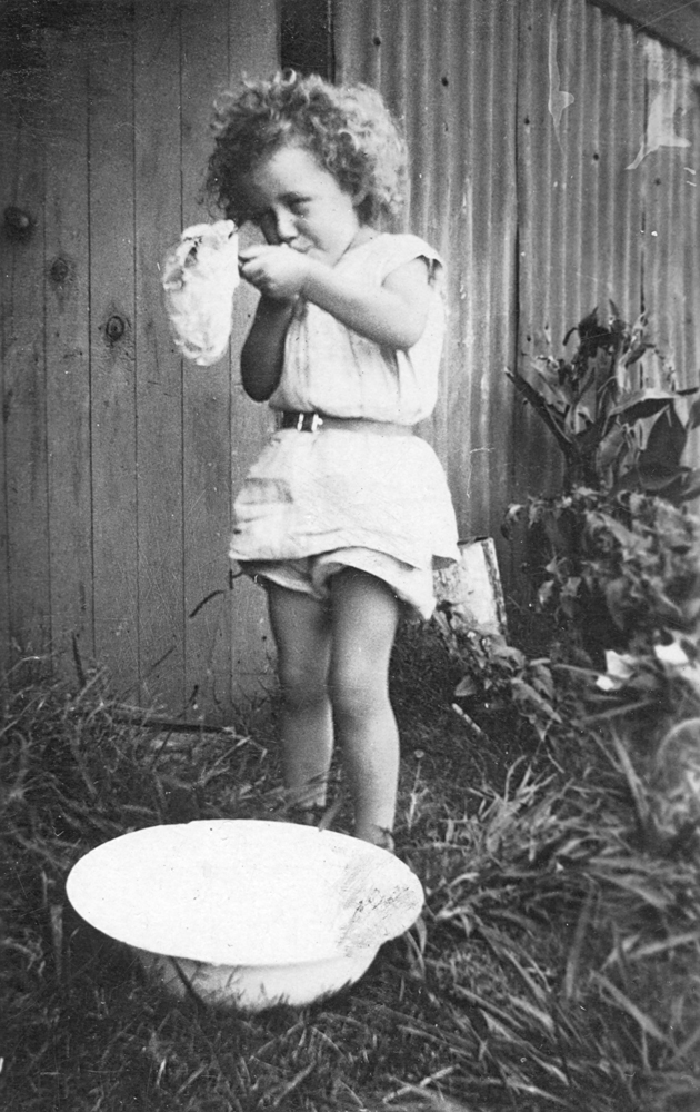 Child blowing bubbles, Ipswich, c.1928