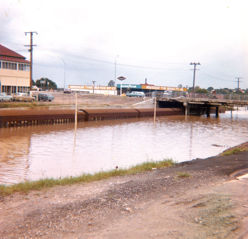Train at back of Ipswich Railway Station during flood, Ipswich, 1974