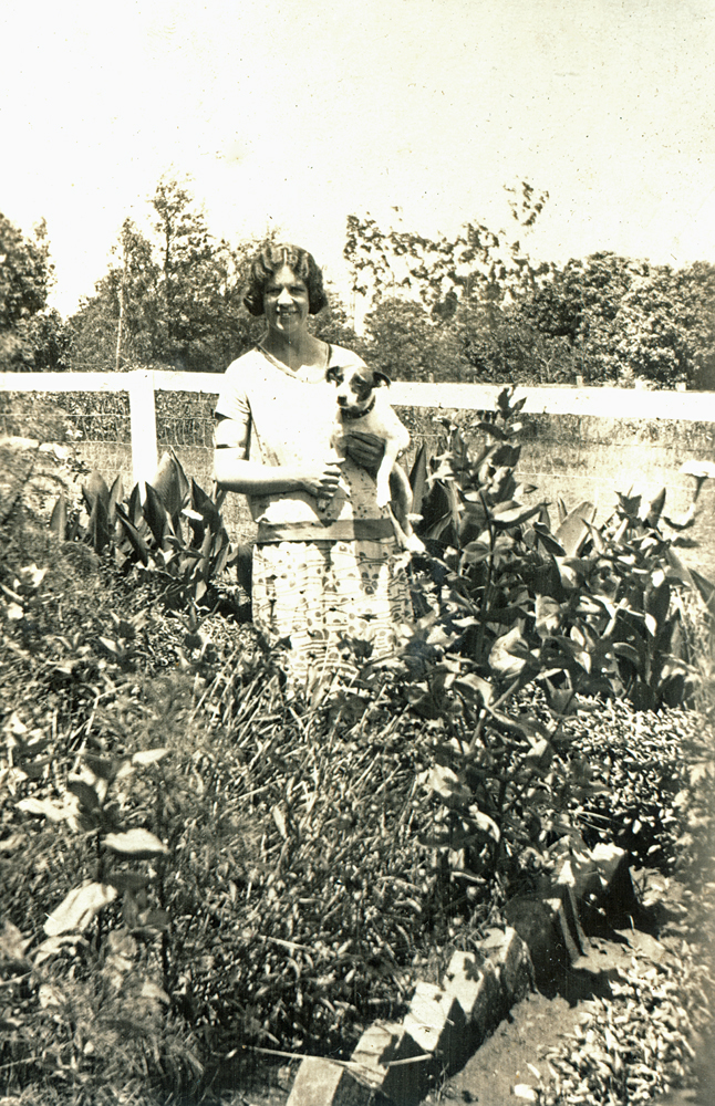 Myra Leard in Queenie Jones' garden at Oakleigh, Redbank Plains, Ipswich, c.1920