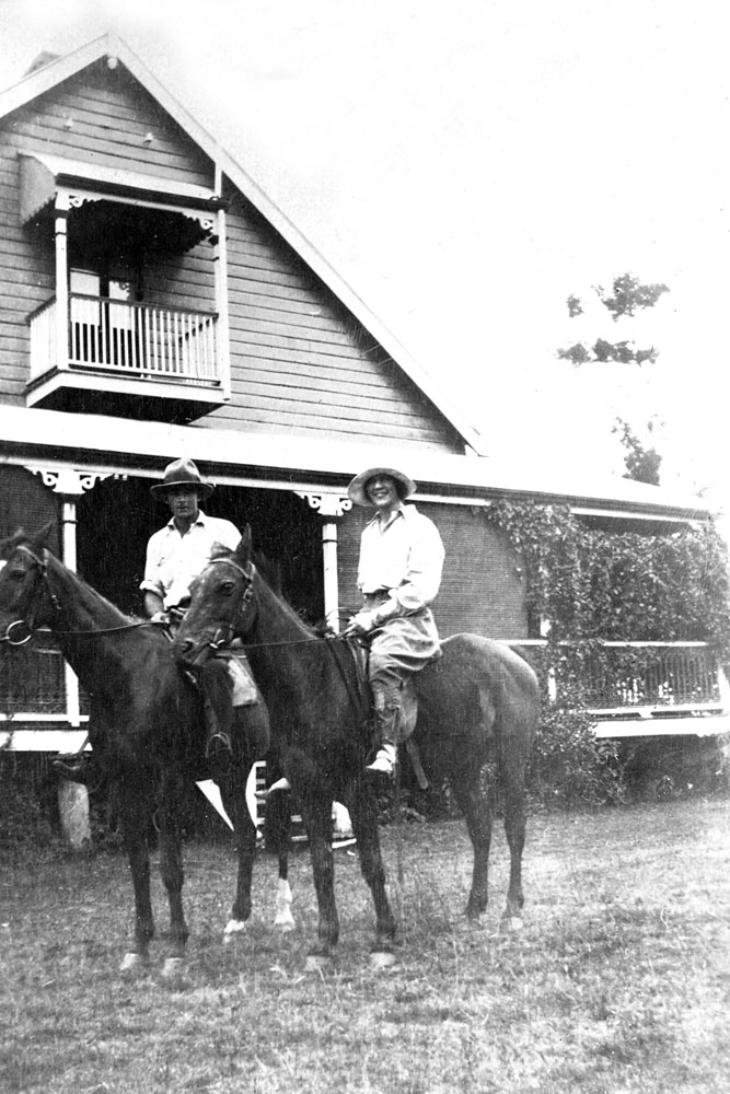 Oakleigh, in background with Merv Jones and Myra Leard on horseback, Redbank Plains, Ipswich, 1920s.