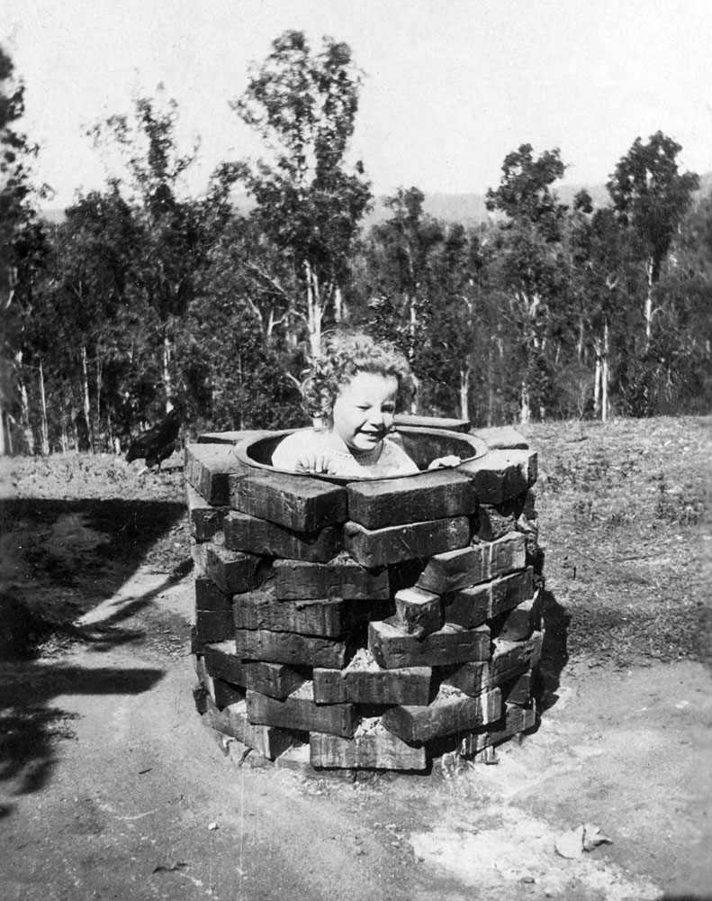 Valma Jones in a copper boiler at Oakleigh (house), Redbank Plains, Ipswich, ca. 1921