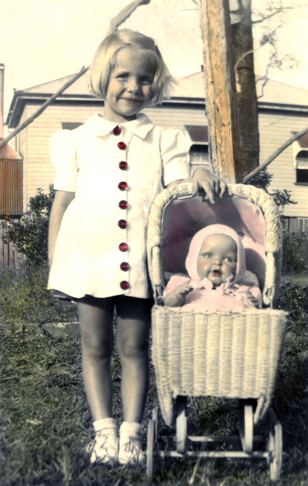 Child with doll and pram, Tantivy Street, North Ipswich, 1943