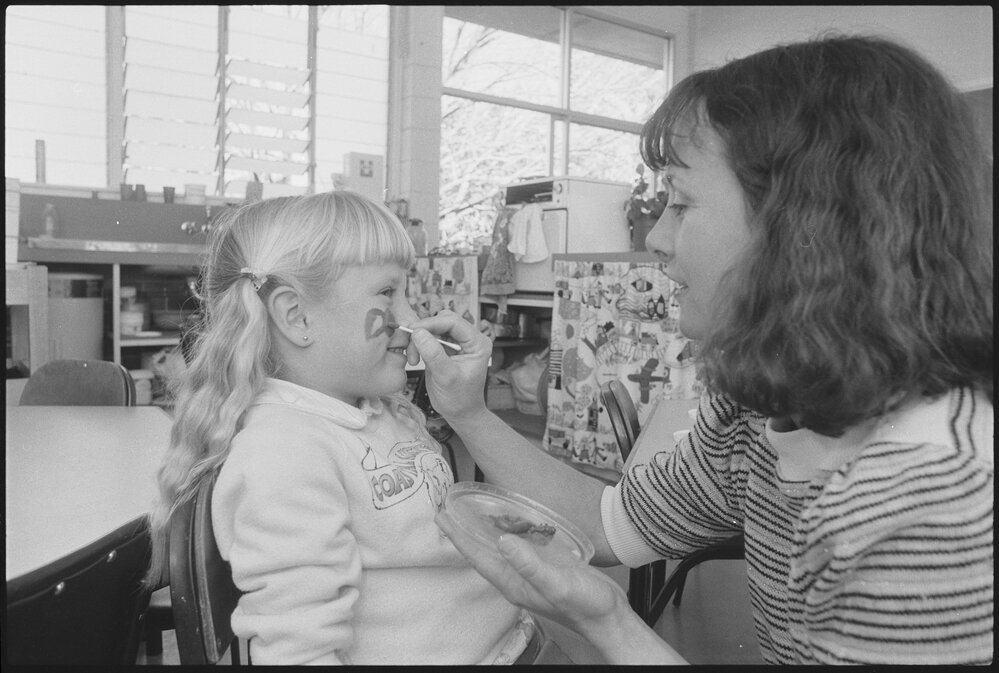 Unidentified child getting her face painted, Ipswich, July 1985