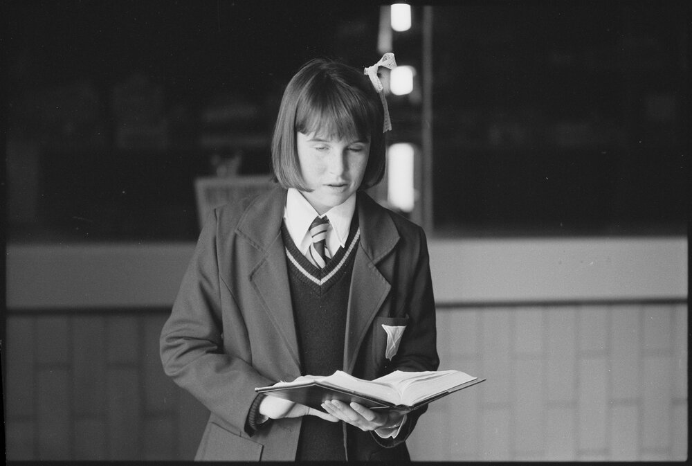 Unidentified schoolgirl reading a book, Ipswich, July 1985