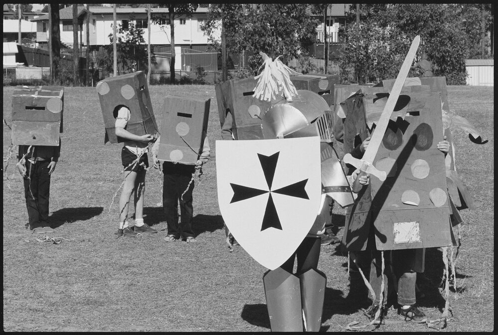 Group of unidentified children dressed in cardboard costumes, Ipswich, July 1985