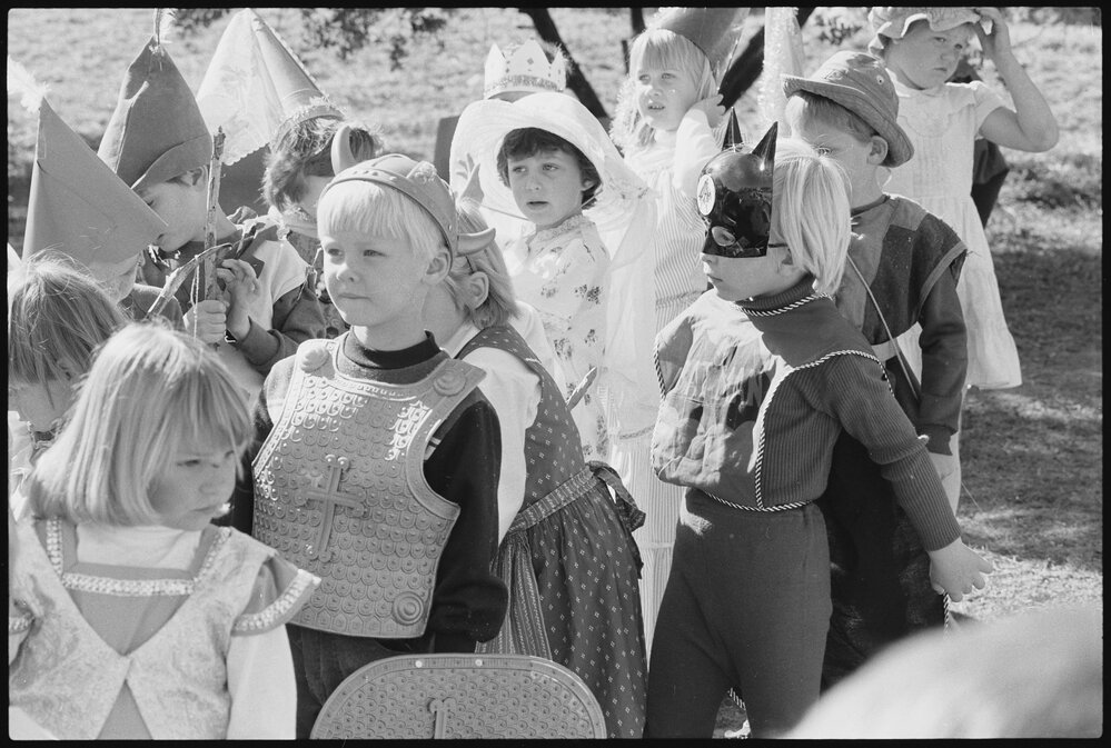 Unidentified children dressed in medieval costume, including Medieval Batman, thought to be for the Book Week event 'Book Banquet', Ipswich, July 1985