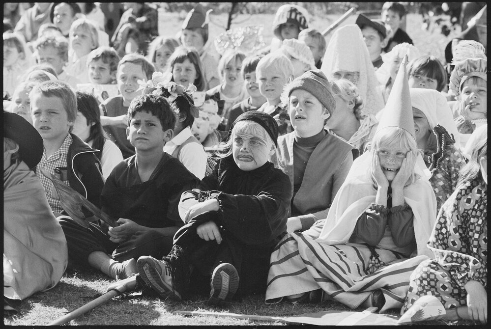Unidentified children dressed in medieval costume, including princesses and an executioner, thought to be for the Book Week event 'Book Banquet', Ipswich, July 1985
