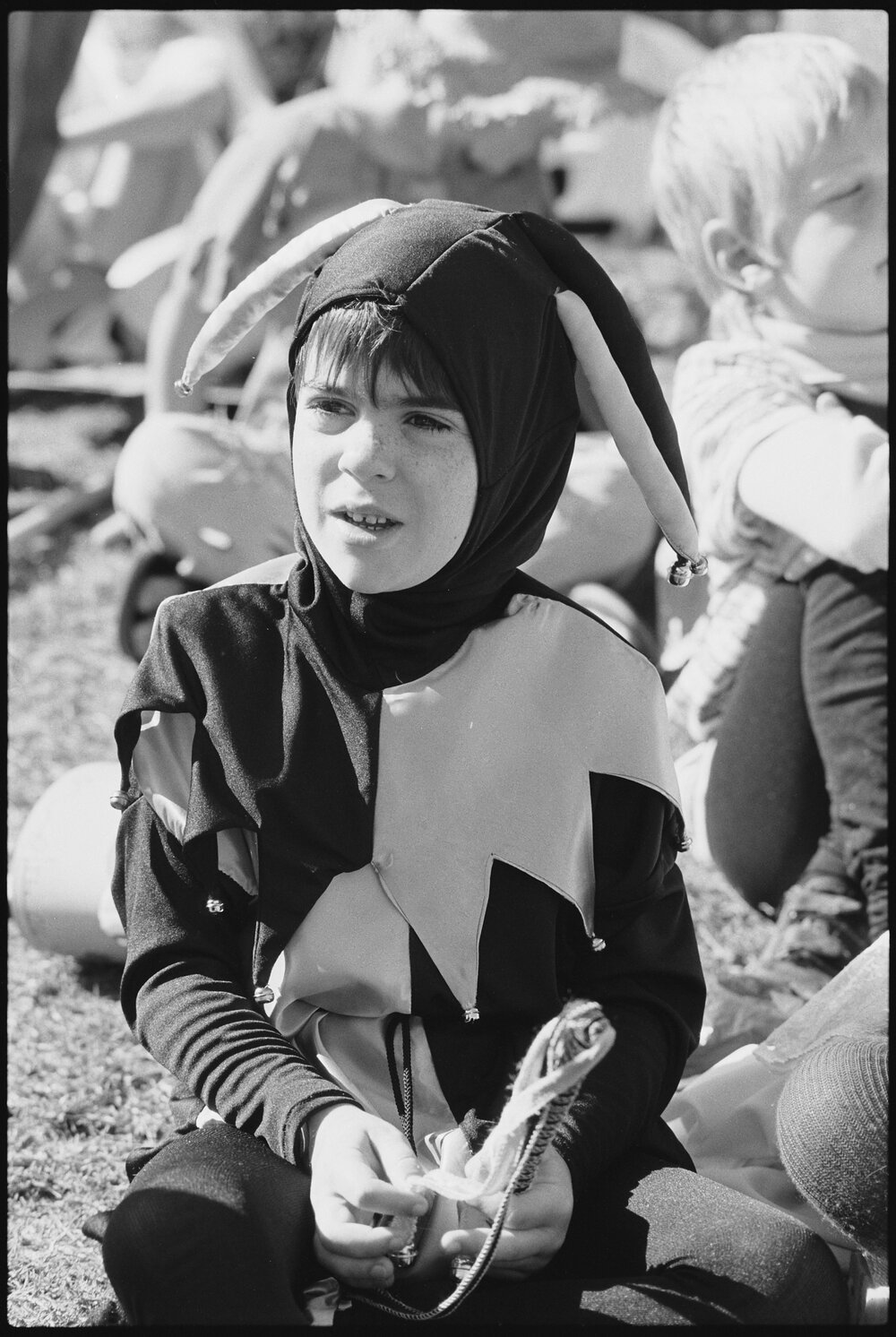 Unidentified child dressed as a jester, Ipswich, July 1985