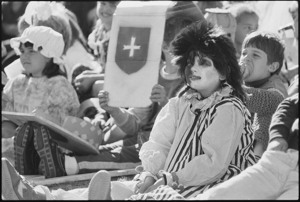 Unidentified children dressed in medieval costume, including a harlequin, thought to be for the Book Week event 'Book Banquet', Ipswich, July 1985