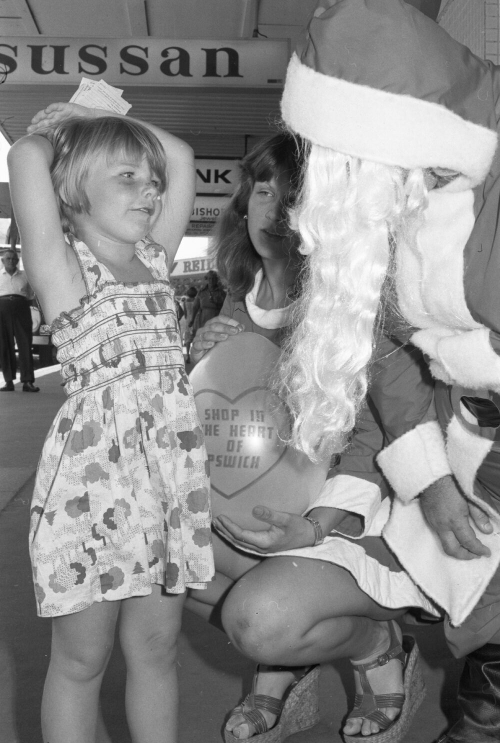 Santa with helper and Debby Mulrain on Brisbane Street, Ipswich, December 1977