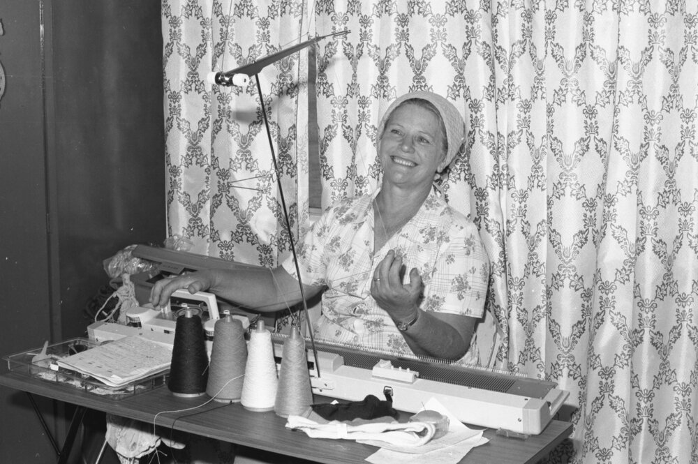 Unidentified woman with knitting machine, Ipswich, Queensland, January 1978