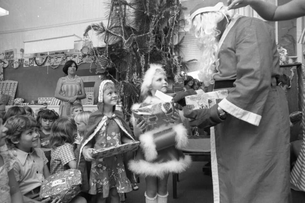 Santa Claus handing out presents, Ipswich, December 1977
