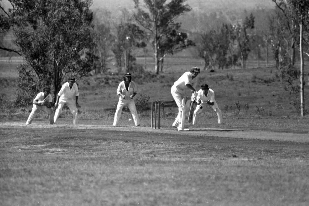 Men playing cricket, Ipswich, December 1977