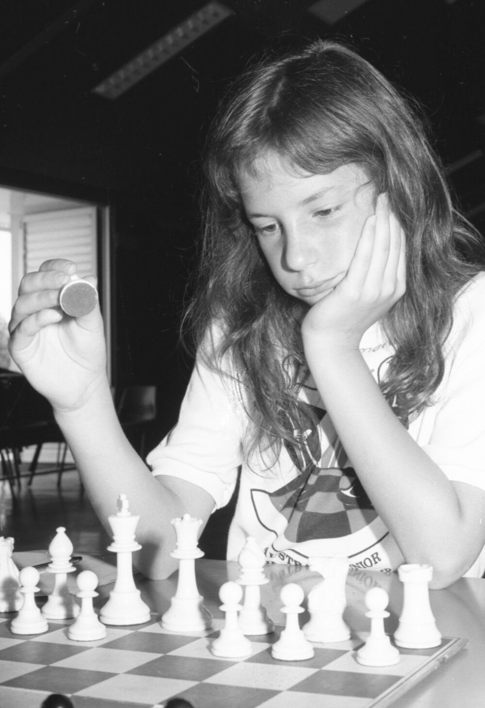 Young girl playing chess at the Australian Junior Chess Championship tournament, Ipswich, Queensland, January 1978