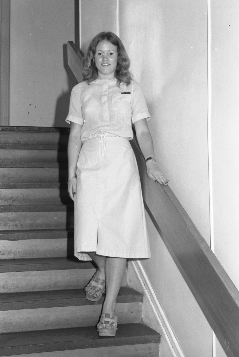 Reid's Department Store model in drawstring blouse and front slit skirt, Ipswich, January 1978
