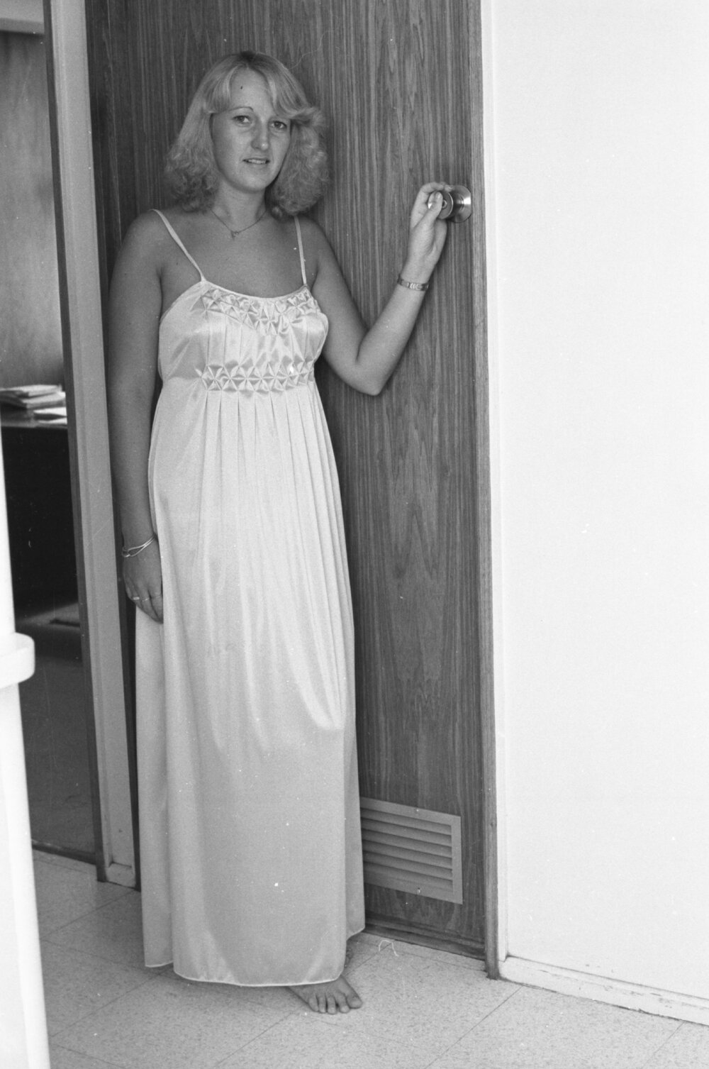 Reid's Department Store model in smocked satin nightdress, Ipswich, January 1978