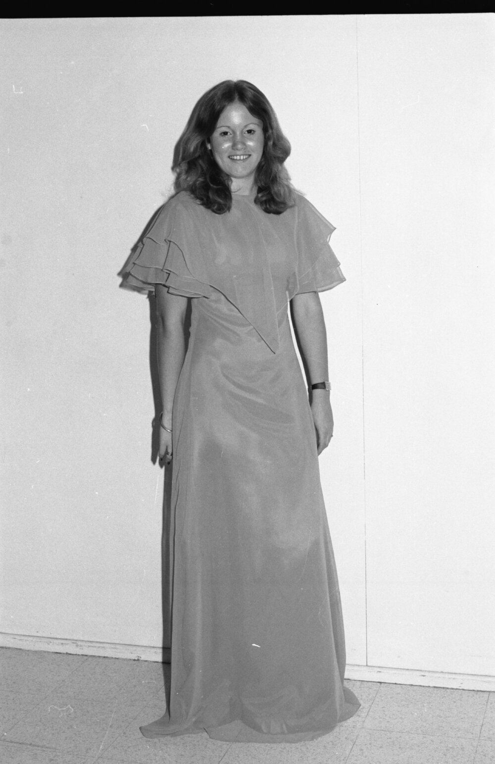 Reid's Department Store model in chiffon maxi dress, Ipswich, January 1978